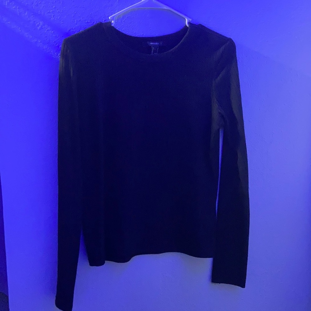 a long sleeve black shirt.